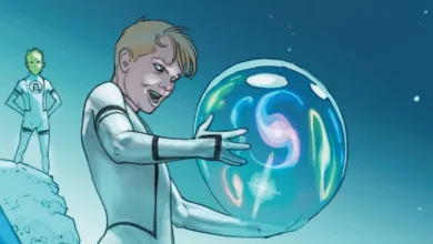 A young person in a white futuristic suit holds a large glowing blue orb filled with swirling lights and colors; another person in a similar suit stands in the background on a rocky surface.