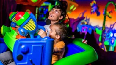 Guests ride Buzz Lightyear Astro Blasters