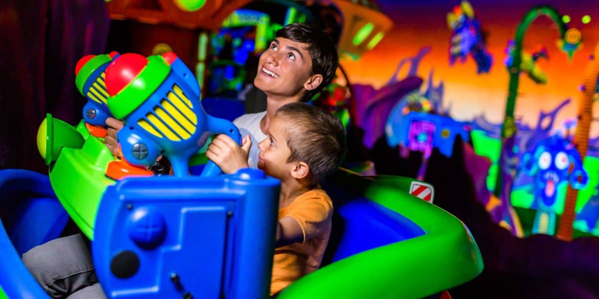 Guests ride Buzz Lightyear Astro Blasters