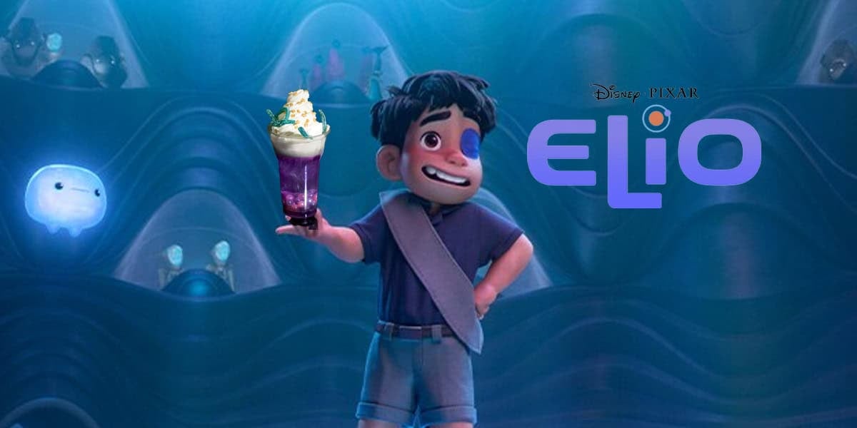 A boy with dark hair and a blue shirt stands smiling and holding a colorful drink with whipped cream. He is in a blue, futuristic room with glowing orbs. The Disney Pixar "Elio" logo appears beside him.
