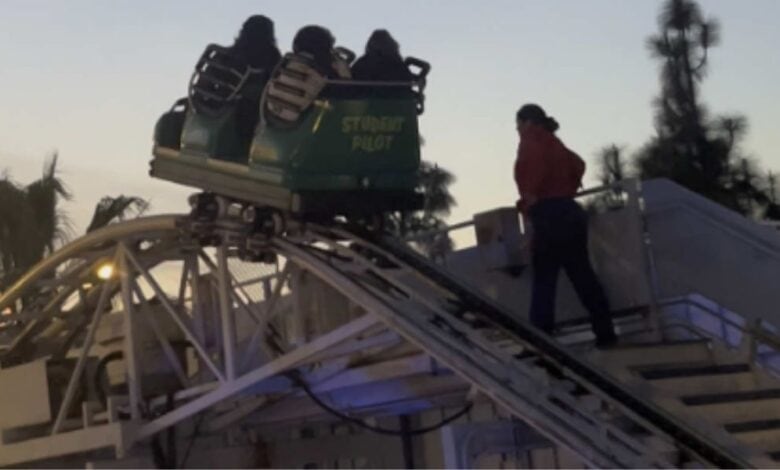 A Disney cast member readying to evacuate guests from Goofy's Sky School