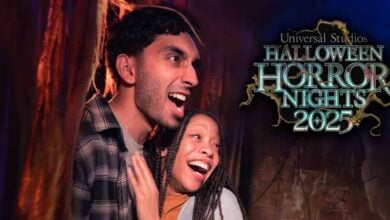 A man and woman scream and laugh together in fright at a haunted house, with the Universal Orlando Halloween Horror Nights 2025 logo overlaid on the right side.