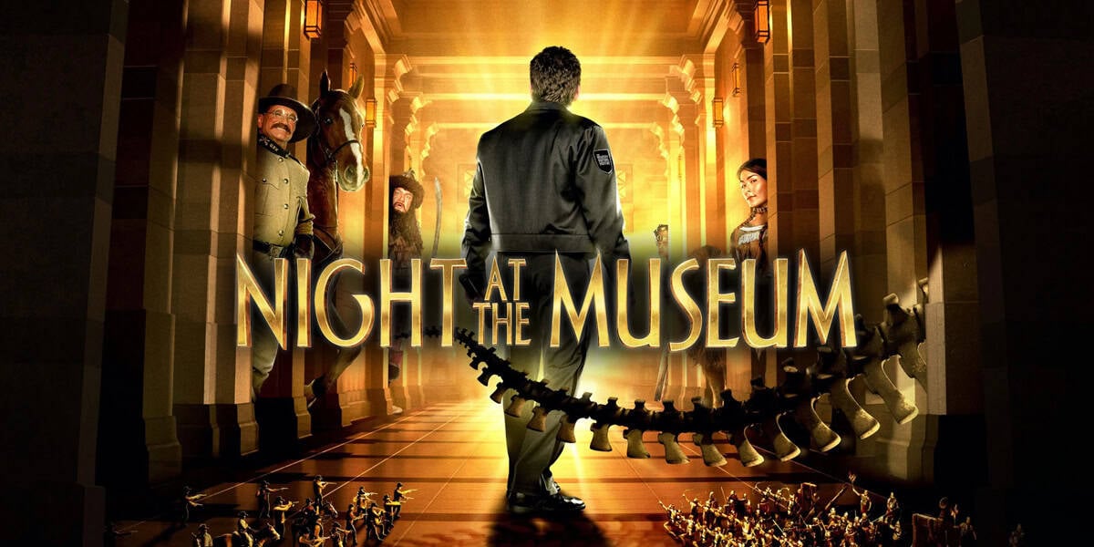 A man in a security uniform stands in a museum hallway with golden light shining behind him, surrounded by historical figures and miniatures. The text “Night at the Museum” appears, hinting at night-at-the-museum-reboot-details-2025.