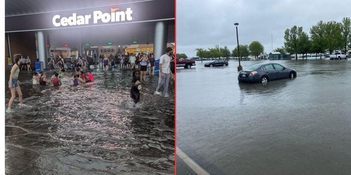 A flooded Cedar Point entrance with people wading through water on the left, and a parking lot with a partially submerged car and high water on the right.