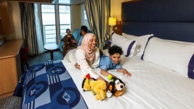 A family in their stateroom on the Disney Magic cruise ship
