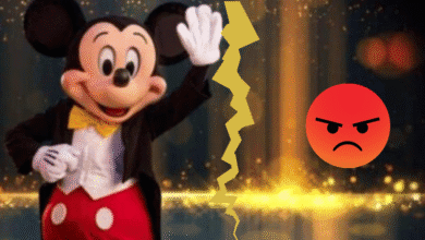 A person in a Mickey Mouse costume waves, separated by a jagged yellow line from an angry red emoji face on a sparkling background.
