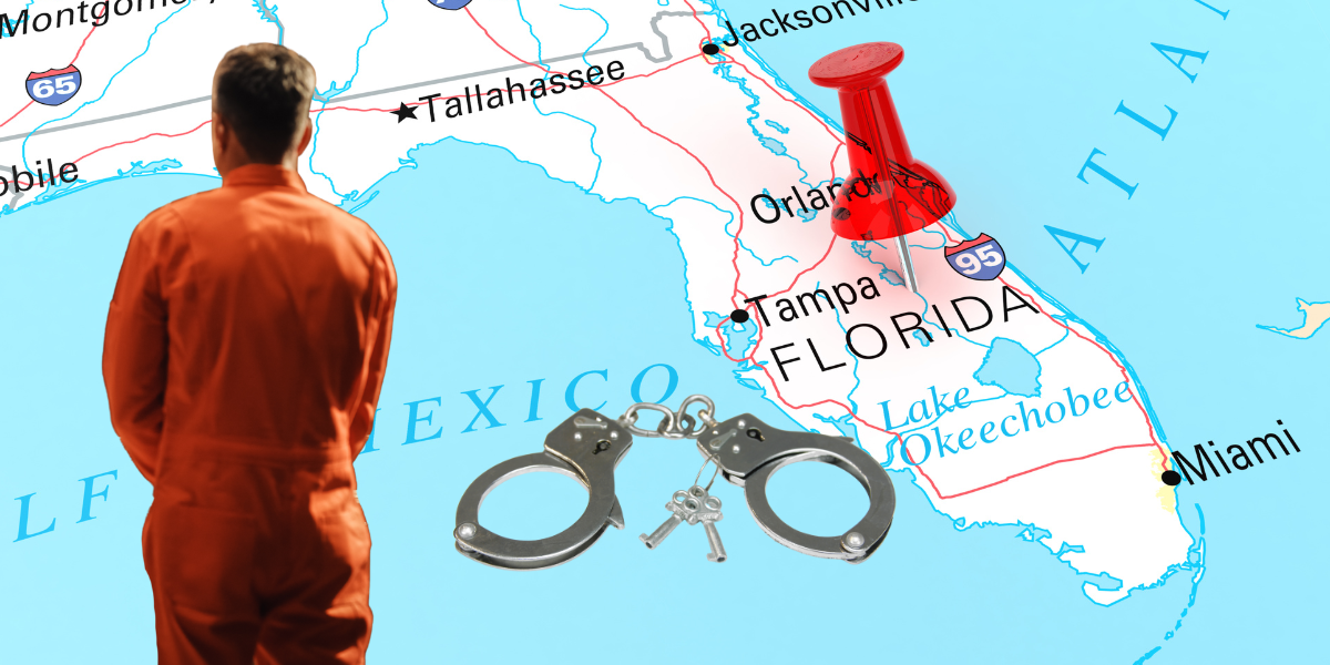 A man in an orange jumpsuit faces a map of Florida, with a red pushpin marking the state and a pair of handcuffs and keys placed over the map near Tampa and Orlando.