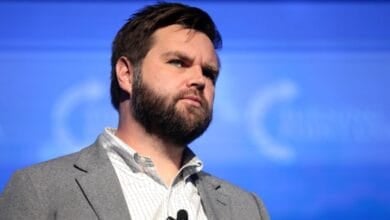 JD Vance on stage at a conference.