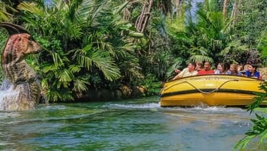 A group of people ride Jurassic Park River Adventure at Universal Orlando Resort.