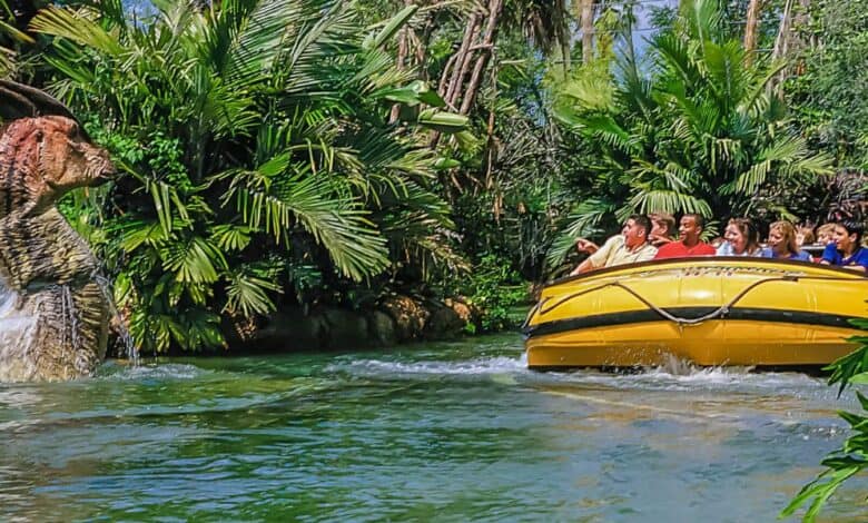 A group of people ride Jurassic Park River Adventure at Universal Orlando Resort.
