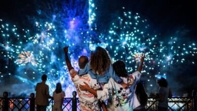 A family watching the Luminous The Symphony of Us fireworks at EPCOT