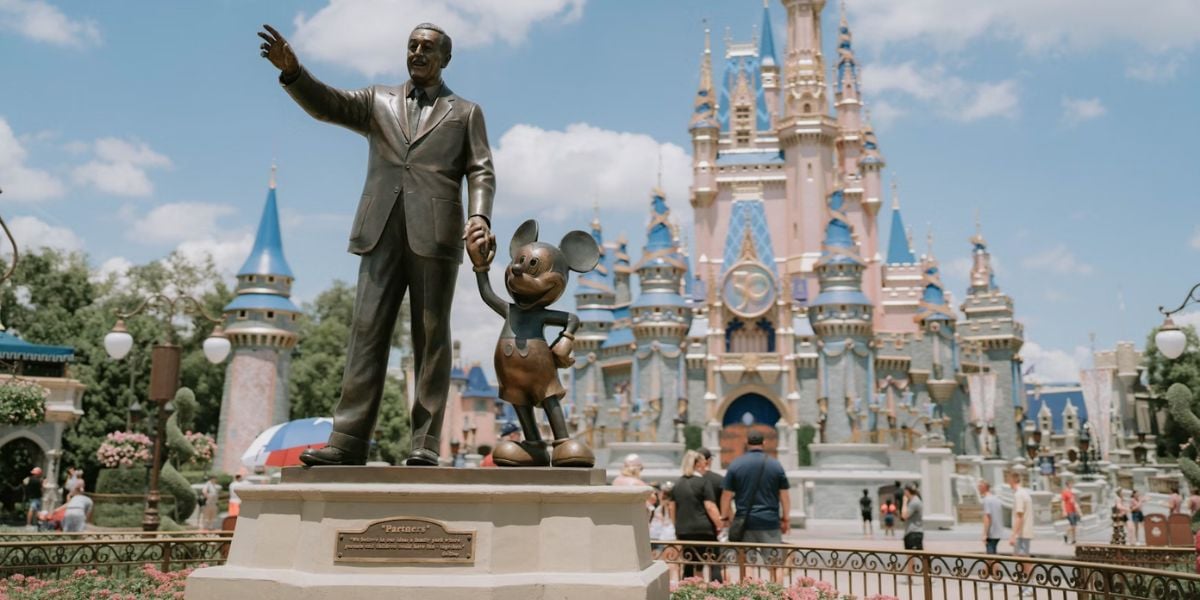 Crowds near the Partners Statue at Magic Kingdom.