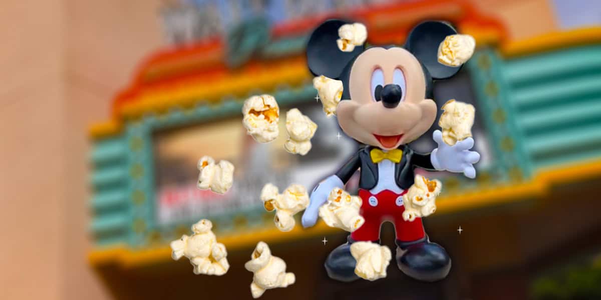 A cheerful cartoon mouse character stands in front of a colorful, blurred theater marquee, surrounded by floating pieces of popcorn.