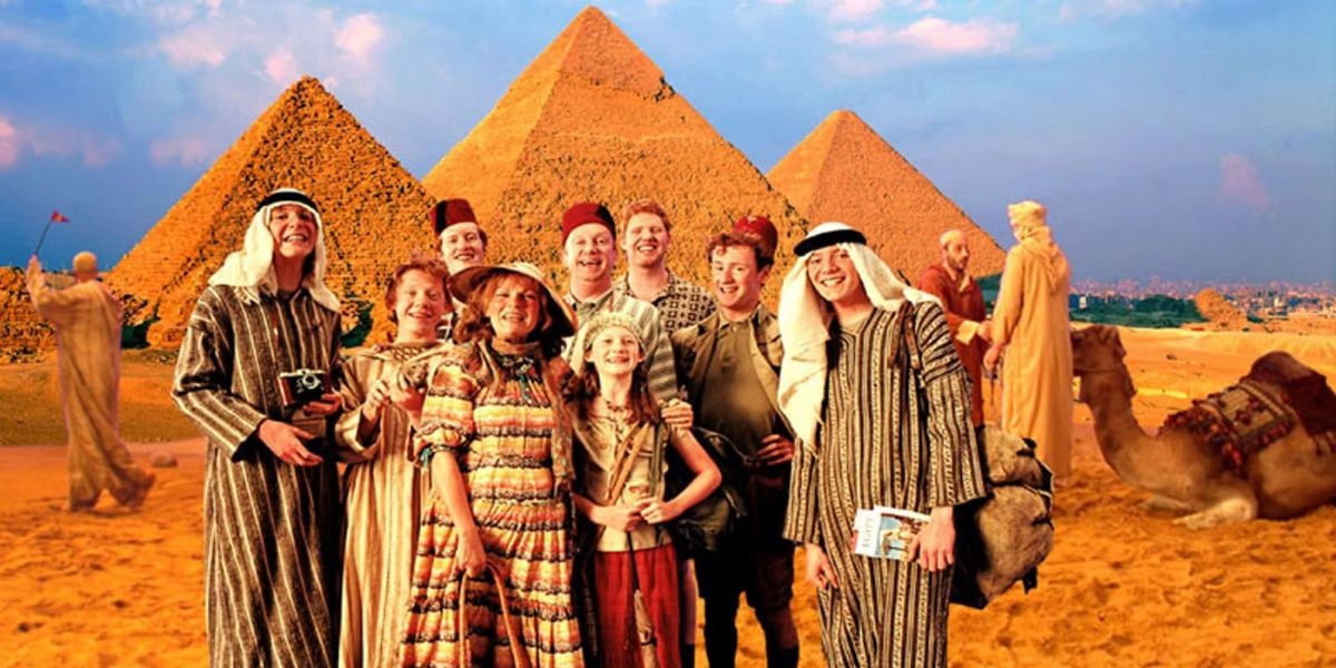 The Weasley family poses in front of the pyramids in Egypt