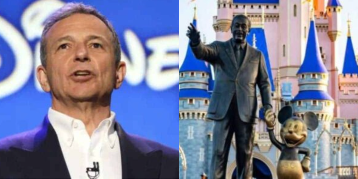 A man in a suit stands in front of a Disney logo on the left; on the right, a statue of Walt Disney holding hands with Mickey Mouse stands in front of a Disney castle.