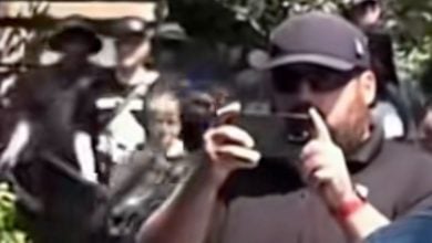 A cast member filming at Disneyland.