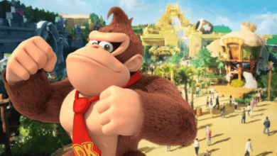 Donkey Kong stands confidently with fists raised in front of a vibrant, tropical-themed amusement park featuring jungle scenery, a banana-shaped building, and people exploring the attractions.