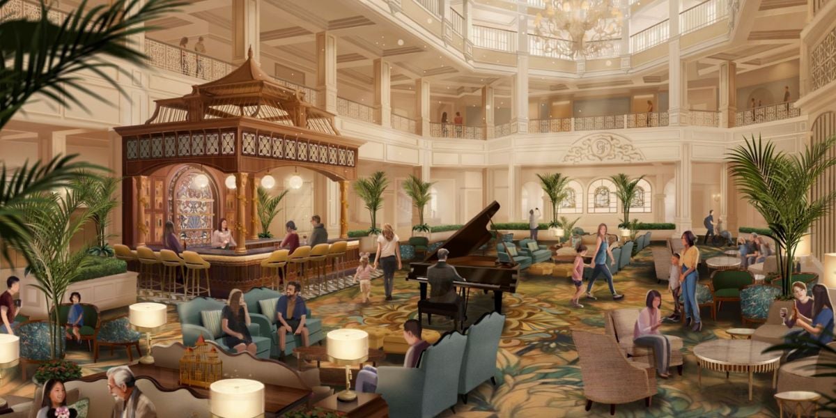 A grand hotel lobby with elegant decor, large chandeliers, a central piano, and a gazebo-style bar overlooks the nearby monorail, as guests relax on sofas among lush green plants in a spacious, sunlit setting.
