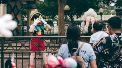 Pinocchio and Gepetto hide their faces at Hong Kong Disneyland