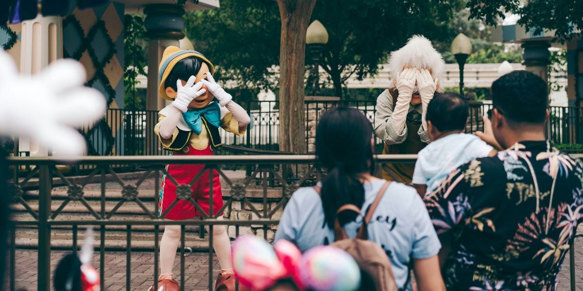 Pinocchio and Gepetto hide their faces at Hong Kong Disneyland