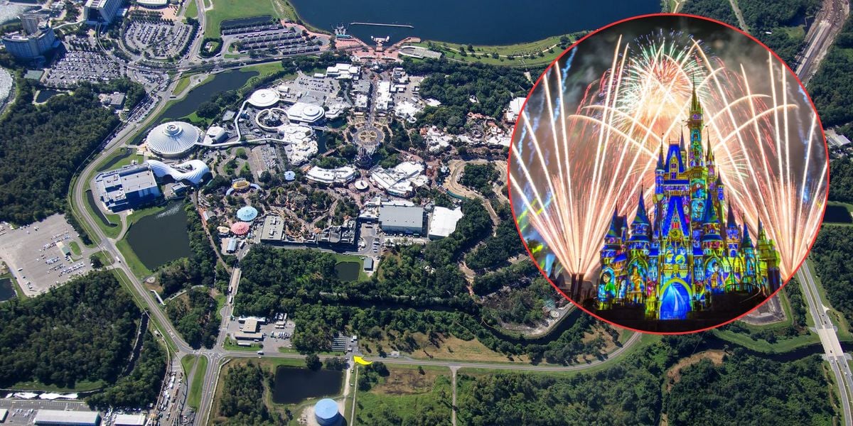 Aerial view of a theme park complex surrounded by greenery, with an inset showing a brightly lit castle with colorful projections and fireworks in the night sky.