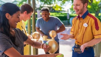guest scans MagicBand at Disney World to use lightning lane pass