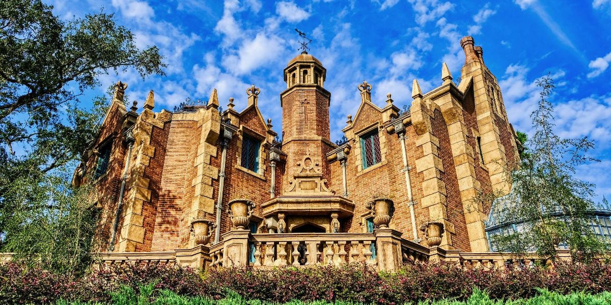 Haunted Mansion against a sunny sky at Magic Kingdom