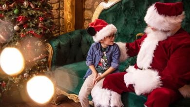 Santa Claus with a young guest at Disney World