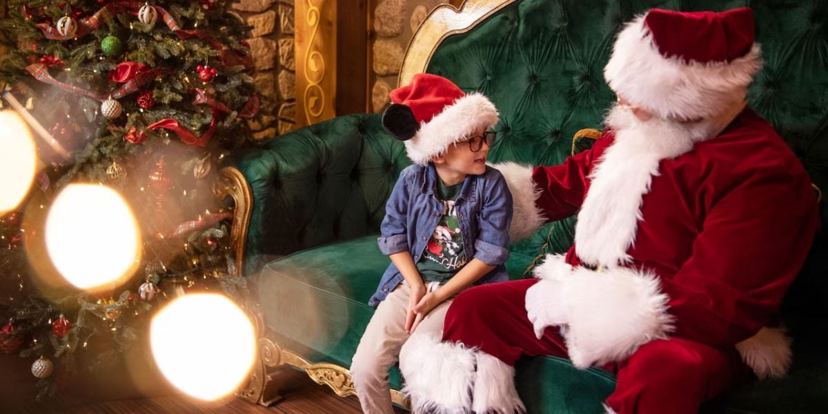 Santa Claus with a young guest at Disney World
