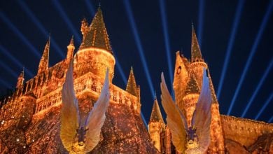 Hogwarts Castle lit up at night in the Wizarding World of Harry Potter at Universal Studios Beijing