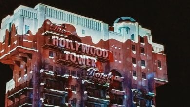 The brightly lit Hollywood Tower Hotel building at night, at Walt Disney Studios Park.
