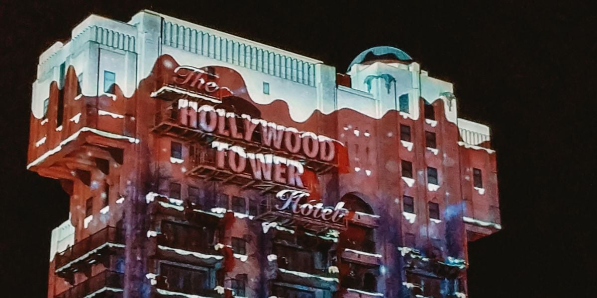The brightly lit Hollywood Tower Hotel building at night, at Walt Disney Studios Park.