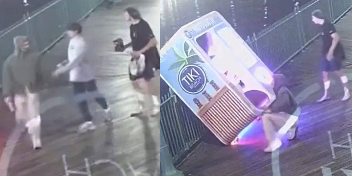 Security footage shows three people walking at night on a boardwalk in the first frame; in the second frame, one person is sitting in front of a toppled Tiki Juice stand that is glowing with lights.