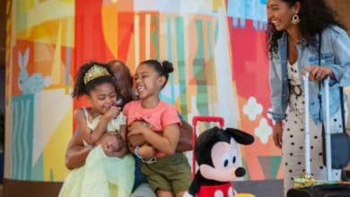 A family sits in the lobby of a Disney World hotel