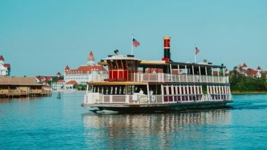 A Walt Disney World ferry boat in front of the Grand Floridian Resort & Spa.