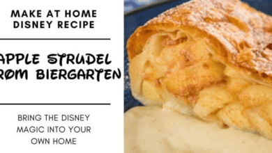 A slice of apple strudel with golden flaky crust sits on a plate, topped with creamy sauce. Text reads: "Make at home Disney Apple Strudel recipe from Biergarten. Bring the Disney magic into your own home.