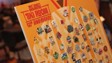 A Disney pin trading board themed to the Enchanted Tiki Room.