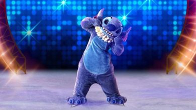 Stitch twirls on an illuminated stage in a sparkling skating costume, creating Disney+ giveaway magic for delighted park guests.
