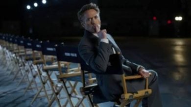 Robert Downey Jr. makes "shush" gesture as he sits in cast chair for Avengers: Doomsday
