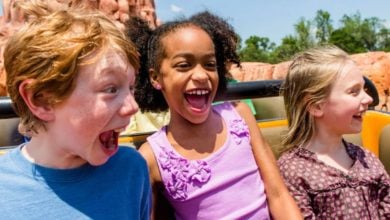three younger guests ride Big Thunder Mountain in Disney World's Magic Kingdom park