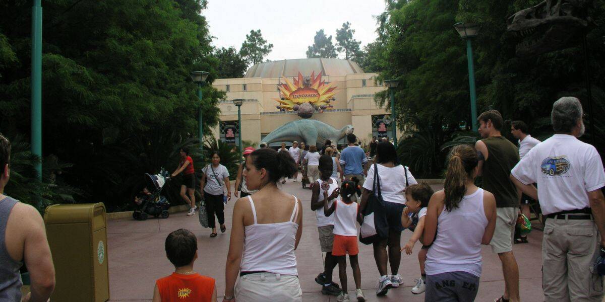 Guests gather outside the Dinosaur ride entrance at Disney’s Animal Kingdom.