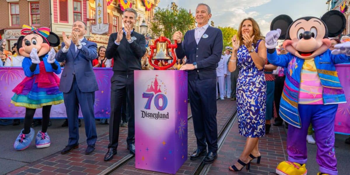 Josh D'Amaro and Bob Iger celebrating Disneyland's 70th anniversary on Main Street, U.S.A. with Minnie and Mickey Mouse