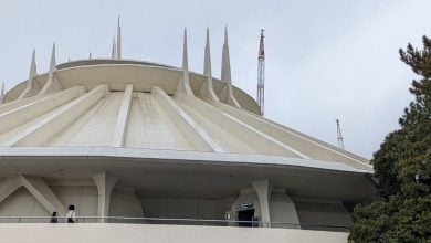 Guests walking into Space Mountain at Tokyo Disneyland.