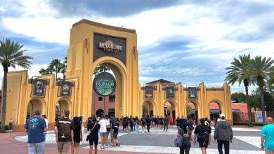 fans walk toward Universal Studios Florida archway during HHN