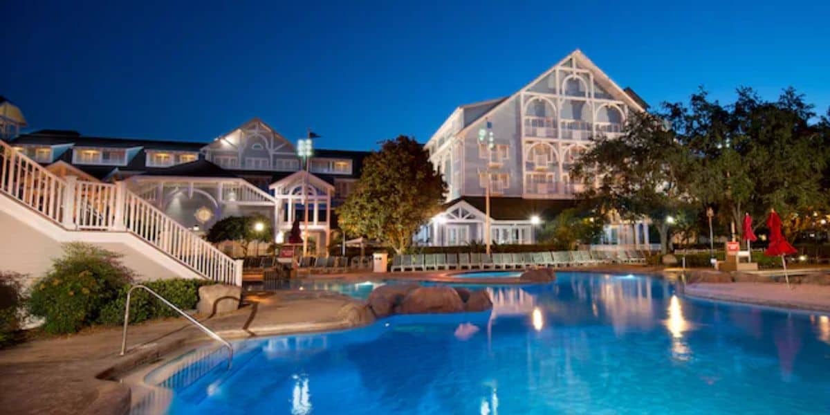 Exterior of Disney's Beach Club and the pool lit up at night