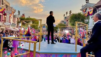 Josh D’Amaro addresses Disney fans in Disneyland as Bob Iger stands nearby