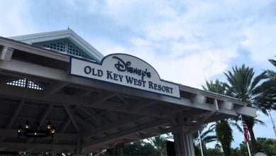 Disney’s Old Key West Resort welcome sign surrounded by lush palms, setting the scene for a magical Disney World escape.