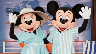 Mickey and Minnie Mouse in their nautical outfits in the Disney Vacation Club lounge at EPCOT