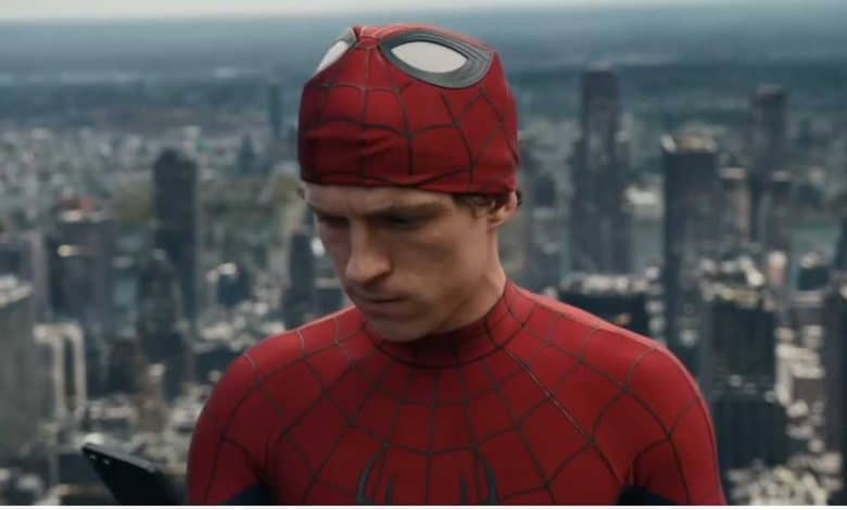 Spider-Man (Tom Holland) unmasked with NYC in the background