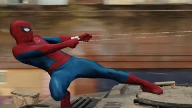 Tom Holland in 'Spider-Man: Brand New Day' standing on top of a tank shooting spider webs